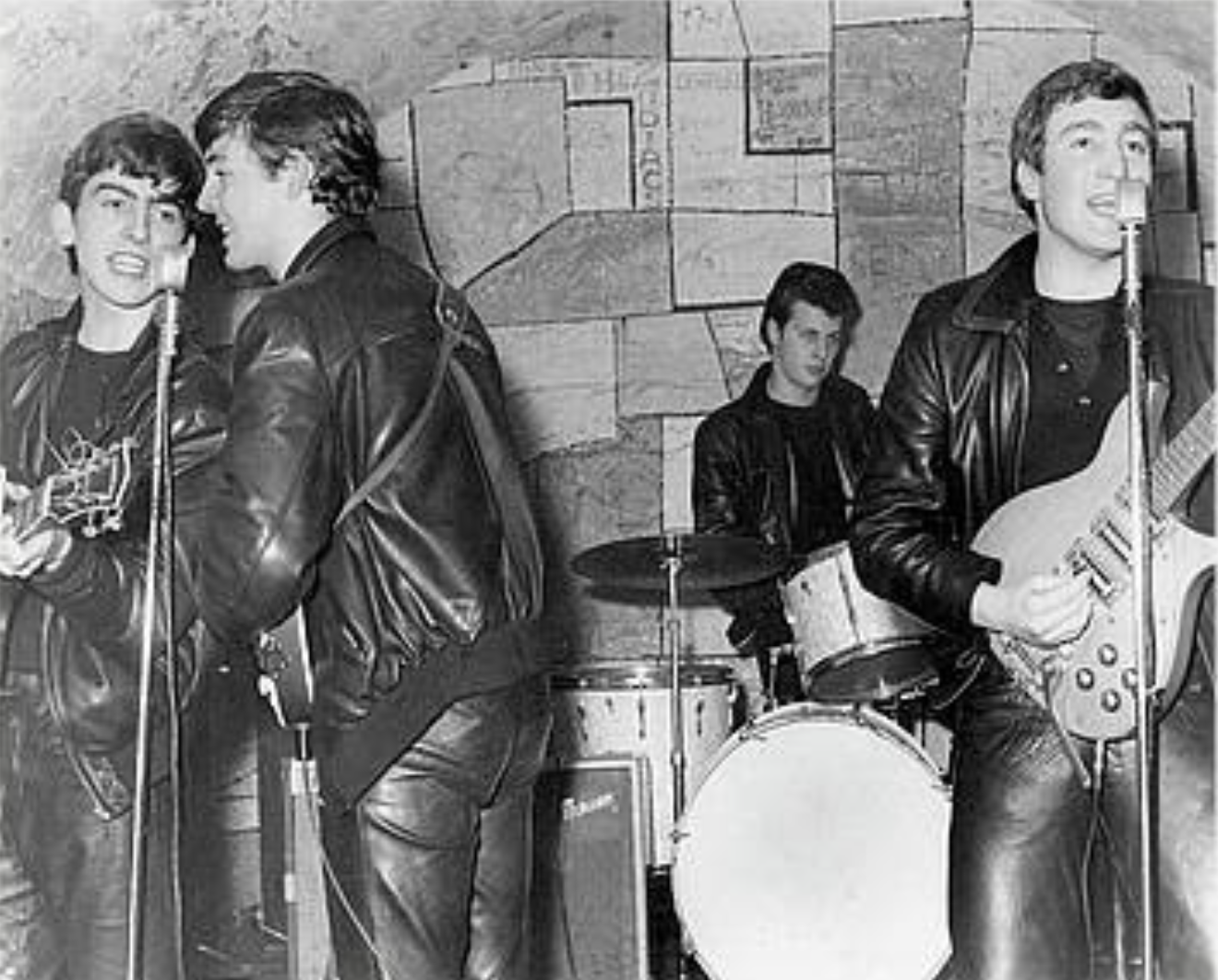 Photo of the Beatles performing at teh Cavern Club (Pete Best on drums). Original source: Getty Images, https://photos.com/featured/beatles-performing-at-the-cavern-club-michael-ochs-archives.html.